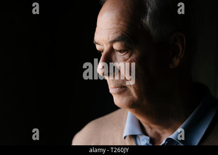 Close-up of serious senior man Stock Photo
