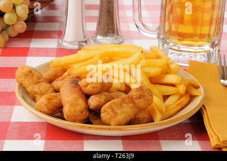 Breaded chicken strips with french fries and beer Stock Photo