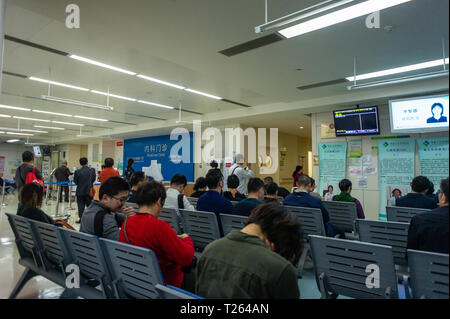 Waiting room of a hospital with patients in Shenzhen, China Stock 