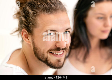 Affectionate couple , man looking at camera, smiling Stock Photo