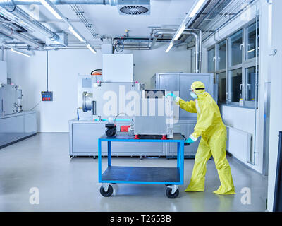 Chemist working in industrial laboratory clean room Stock Photo
