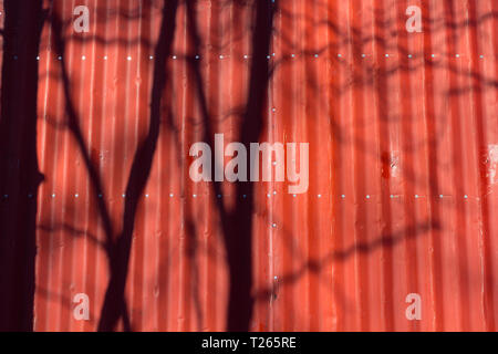 Red metal tile texture. The texture is red. Red wall Stock Photo