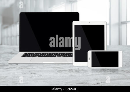 Set of modern technology devices template for responsive design presentation including: laptop, tablet and smartphone at the office Stock Photo