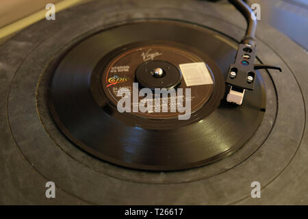 Close-up of 45 RPM vinyl record of Culture Club's song 'Karma Chameleon' released in 1982 by Virgin / Epic Records.; on a record player, turntable. Stock Photo