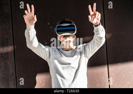 Mature man using VR glasses Stock Photo