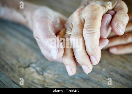Senior couple holding hands, close-up Stock Photo