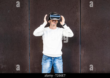 Mature man using VR glasses Stock Photo