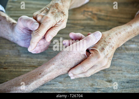 Senior couple holding hands, close-up Stock Photo