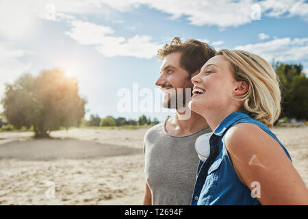 Happy young couple on the beach Stock Photo