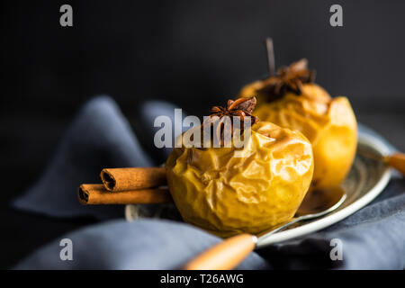 Healthy dessert concept with baked apples with cinnmaon and anise star Stock Photo