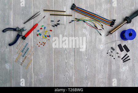 leds, resistors and electronic components with tools on a white vintage background Stock Photo