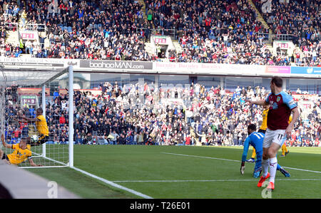 Wolverhampton Wanderers' Conor Coady (in net at front) puts the ball in to the back of his own net for an own goal and the first goal of the game during the Premier League match at Turf Moor, Burnley. Stock Photo