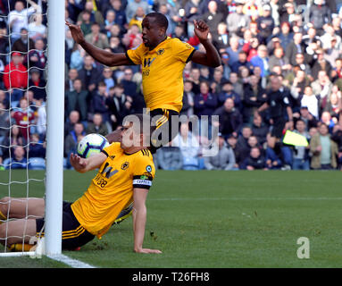 Wolverhampton Wanderers' Conor Coady (in net at front) puts the ball in to the back of his own net for an own goal and the first goal of the game during the Premier League match at Turf Moor, Burnley. Stock Photo