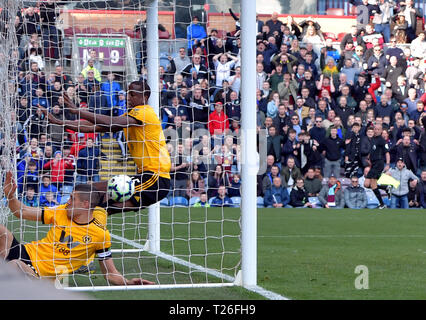 Wolverhampton Wanderers' Conor Coady (in net at front) puts the ball in to the back of his own net for an own goal and the first goal of the game during the Premier League match at Turf Moor, Burnley. Stock Photo