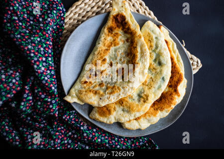 Traditional azerbaijan cuisine flat bread with herbs kutaby Stock Photo
