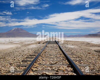 Railroad to Chile on the incredible salt flat of the andean altiplano of Bolivia, South America Stock Photo