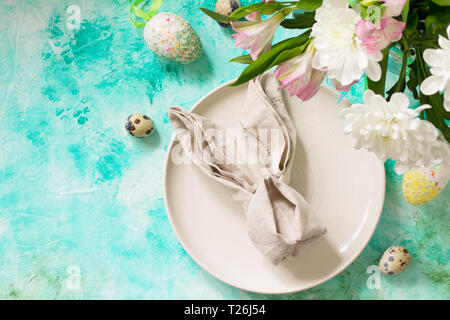 Holidays Easter table Setting with spring flowers. Top view flat lay background with copy space. Stock Photo