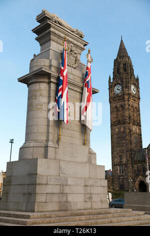 The Cenotaph war memorial (with carved stone flags) designed by the architect Sir Edwin Lutyens, with the Rochdale town Hall behind in the background. Rochdale Lancashire. UK. (106) Stock Photo