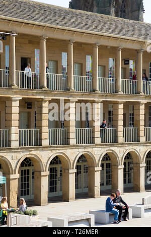 Looking towards the East Wall colonnade / colonnades / balcony / balconies of The Piece Hall. Sunny / sun & blue sky. Halifax, West Yorkshire, UK. (106) Stock Photo