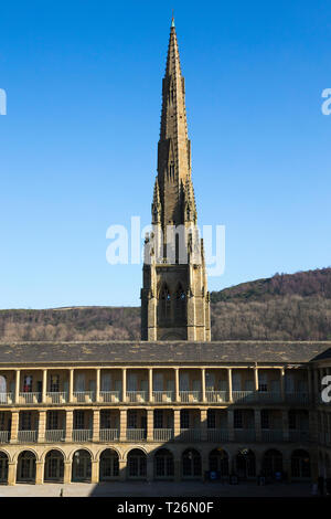 The Piece Hall with Square Chapel church spire behind in the background. Sunny / sun & blue sky. Halifax, West Yorkshire, UK. (106) Stock Photo