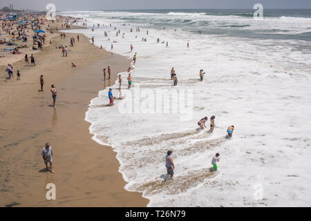 A sunny summer day on Huntington Beach brings a variety of people out to have fun and relax in many diverse engaging hobbies and activities. Stock Photo