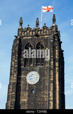 The bell tower (flying the English flag / cross of St George) and clock of Halifax Minster. West Yorkshire. UK. Sunny / sun & blue sky. (106) Stock Photo