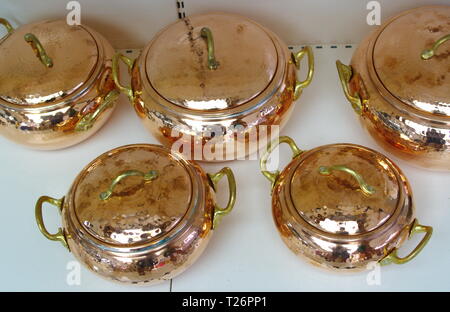 pots made of copper. polished in various sizes