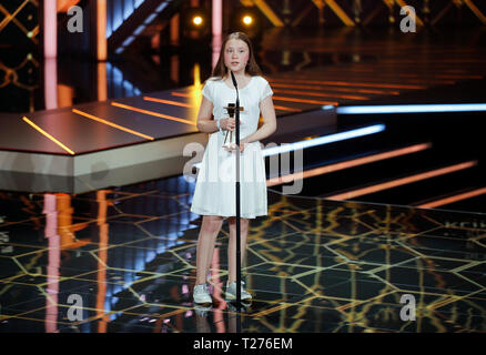 Berlin, Germany. 30th Mar, 2019. Swedish environmental activist Greta Thunberg receives the Special Climate Protection Award during the annual German film and television awards 'Golden Camera' ('Die Goldene Kamera') of German TV magazine 'HoerZu' in Berlin, Germany, March 30, 2019. REUTERS/Hannibal Hanschke/Pool Credit: Hannibal Hanschke/Reuters Pool/dpa/Alamy Live News Stock Photo