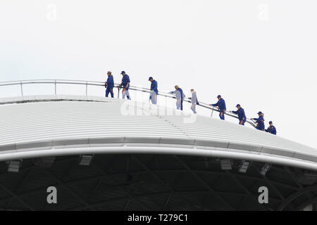Adelaide Australia 31st March 2019.  A group of sightseers walk on the roof  with a harness above  the Adelaide Oval before the kick off of the 2019 AFL Women's Grand Final between Adelaide Crows and Carlton Football Club. The AFLW is an Australian rules football league for female players with the first season of the league began in February 2017 Credit: amer ghazzal/Alamy Live News
