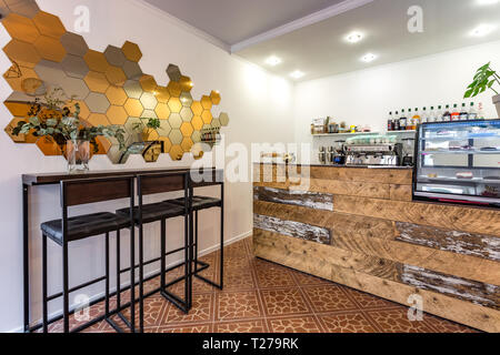 GRODNO, BELARUS - MARCH, 2019: inside interior in small modern pub cafe with loft design style Stock Photo