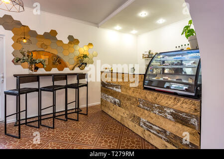 GRODNO, BELARUS - MARCH, 2019: inside interior in small modern pub cafe with loft design style Stock Photo