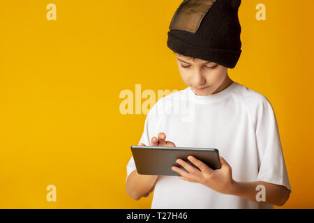 Young gamer cheerful teenage boy playing video games