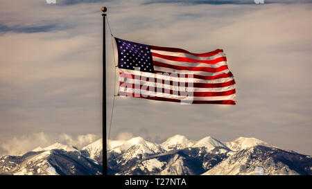 FEB 14, 2019 - MOAB, UTAH, USA - American Flag flies over Lasalle Mountains, Moab, Utah Stock Photo