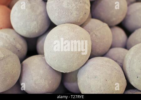 Close up photo of a stack of large, tan bath bombs at a wellness spa Stock Photo