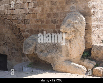 An old stone carved Venetian lion placed along the city notification walls in Famagusta Cyprus Stock Photo