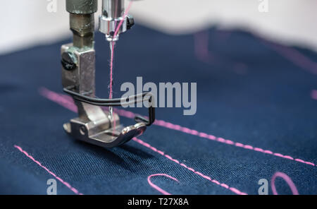 Professional sewing machine close-up. Modern textile industry. Stock Photo