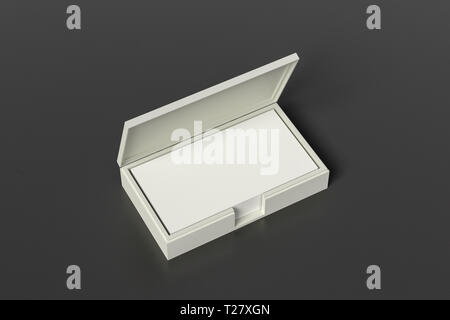 White leather business card box holder with blank business cards in stack on black leather background Stock Photo
