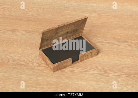 Wooden business card box holder with black business cards in stack on wooden background Stock Photo