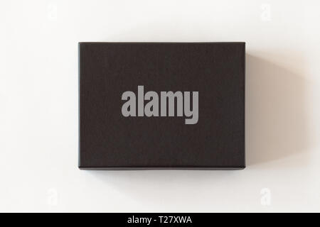 Blank black closed carton box packaging isolated on white background. View above. Stock Photo