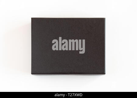 Blank black closed carton box packaging isolated on white background. View above. Stock Photo