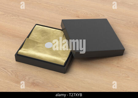 Flat  black leather square box with golden wrapping paper on wooden background Stock Photo