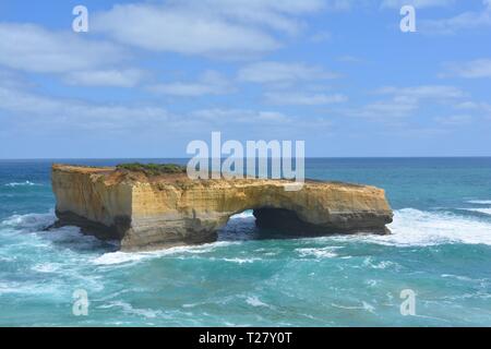 The London Arch, or London Bridge as it was formerly known, is a significant tourist attraction along the Great Ocean Road near Port Campbell Victoria Stock Photo