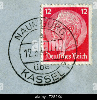 German historical stamp: Paul von Hindenburg on a blue postal envelope with  black ink cancellation, Germany, the Third Reich Stock Photo