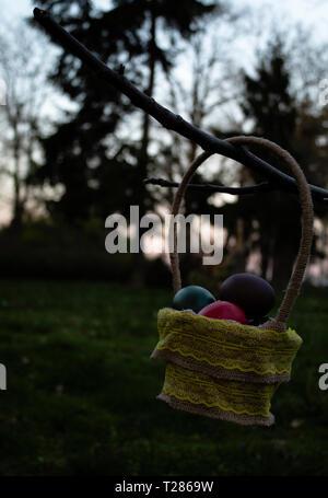 Easter basket hanging on a branch Stock Photo
