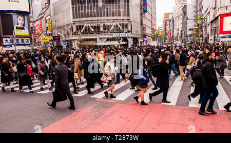 Crowd of people, walking in various directions, crossing the Shibuya crossing, Tokyo, Japan Stock Photo