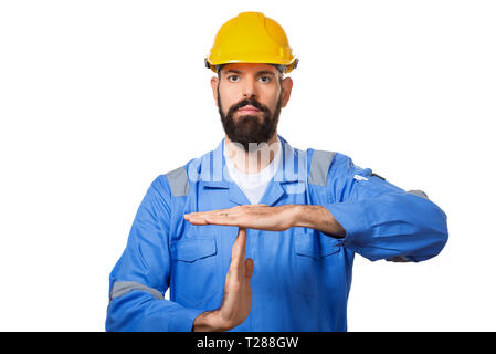 Builder in hard hat, foreman or repairman in the helmet showing stop gesture, Portrait architect builder, civil engineer working, isolated over white  Stock Photo