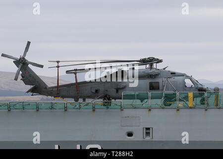 N-976, a Sikorsky MH-60R Seahawk operated by the Royal Danish Navy, on board KDM Absalon on arrival during Exercise Joint Warrior 19-1. Stock Photo