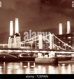 Battersea Power Station over Thames river as the famous London landmark at night. Stock Photo