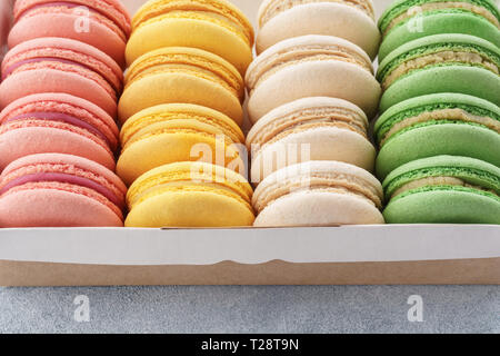 Traditional french macarons in a box for dessert. Close-up. Stock Photo