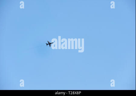 RAF Hawk T1 fighter jet training in the bright blue sky over Whitby North Yorkshire, UK,GB. Stock Photo